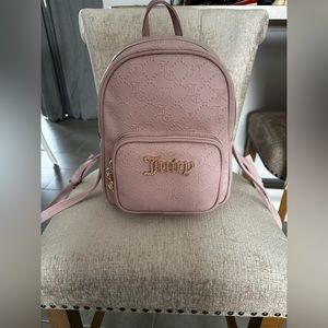 Pink Juicy Couture medium sized backpack.
